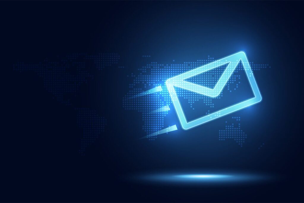Mailchimp-blog-061126 A glowing blue envelope icon with motion lines appears over a digital world map on a dark background, symbolizing fast global email or digital communication.